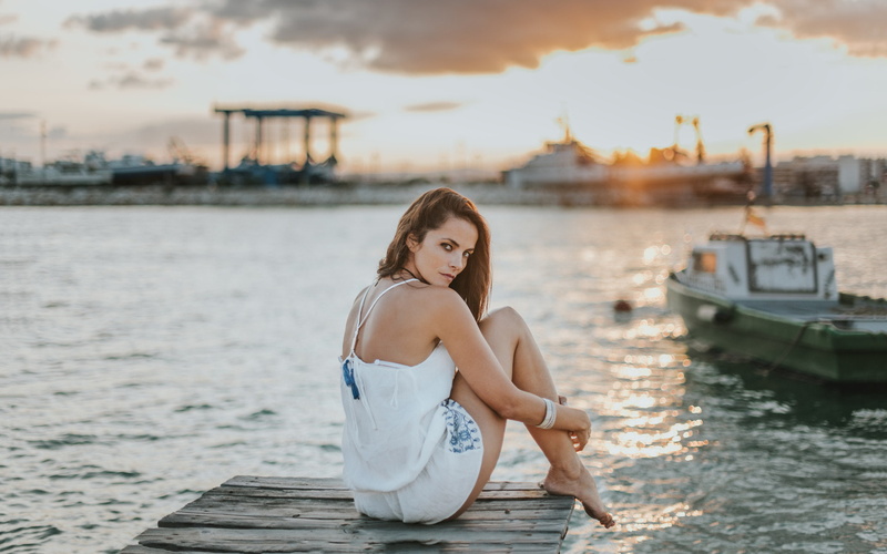 brunette, 1080P, white dress, brown eyes, sitting, Osman Bendezu, harbor, looking over shoulder, women