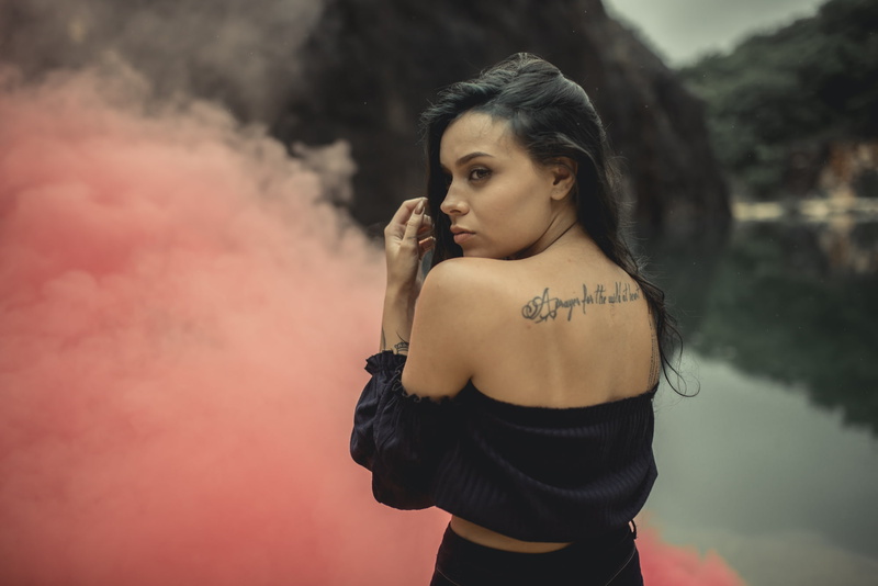 smoke, women outdoors, tattoo, young women, young adult, bare shoulders, hairstyle, front view, brunette, one person, smoke - physical structure, looking