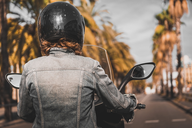 female, motor, woman, day, transportation, one person, lifestyles, leisure activity, riding, street, standing, casual clothing, nature, black, rear view