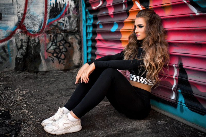 looking away, black clothing, sitting, 2K, wavy hair, women, graffiti, long hair, blonde, portrait, sneakers, yoga pants, Aleksandra Taranova