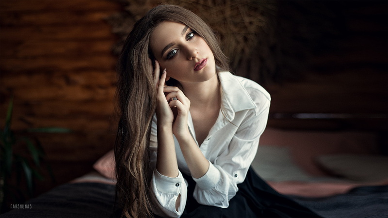 long hair, young adult, green eyes, depth of field, sitting, one person, brunette, 1080P, hair, flirting, beautiful people, hairstyle, adult, glamour