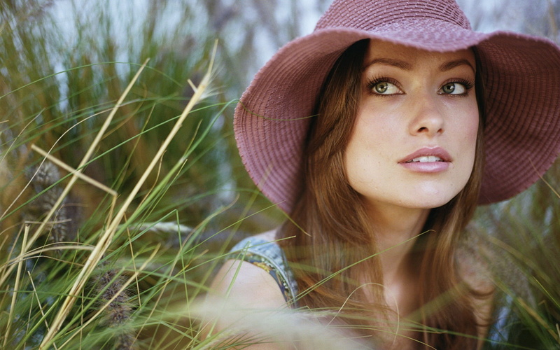 clean skin, outdoors, millinery, actress, hairstyle, lifestyles, brunette, clothing, adult, leisure activity, hat, Olivia Wilde, contemplation, portrait