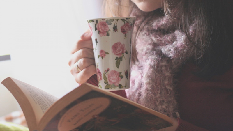 publication, tea, pattern, books, floral pattern, women, pink, tea cup, introvert, front view, midsection, holding, lifestyles, drinking, hairstyle, reading