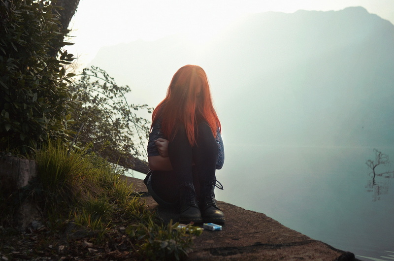 rear view, casual clothing, 1080P, looking at view, introvert, tranquility, growth, redhead, lifestyles, fog, sitting, real people, cliff, tree, full length