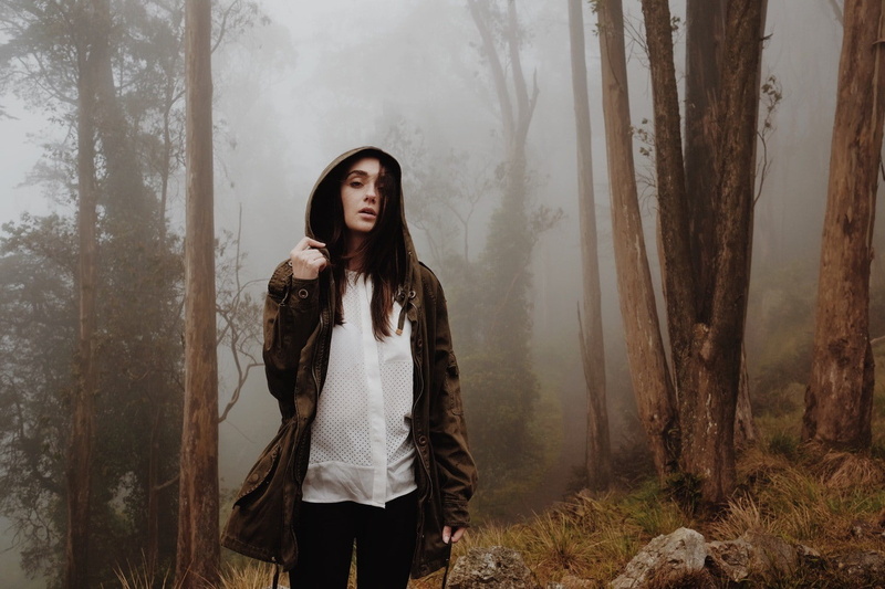 tree trunk, looking at viewer, long hair, hairstyle, mist, brunette, standing, women outdoors, introvert, looking, women, young women, woodland, plant