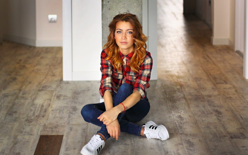 woman, sneakers, beauty, portrait, blonde, jeans, looking at camera, real people, floor, adult, hairstyle, beautiful woman, hardwood floor, casual clothing