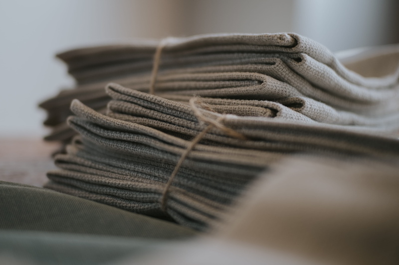 still life, business, close up, no people, domestic room, table, warm, warmth, soft furnishing, placemat, ball of wool, stack, detail, wool, material, linen