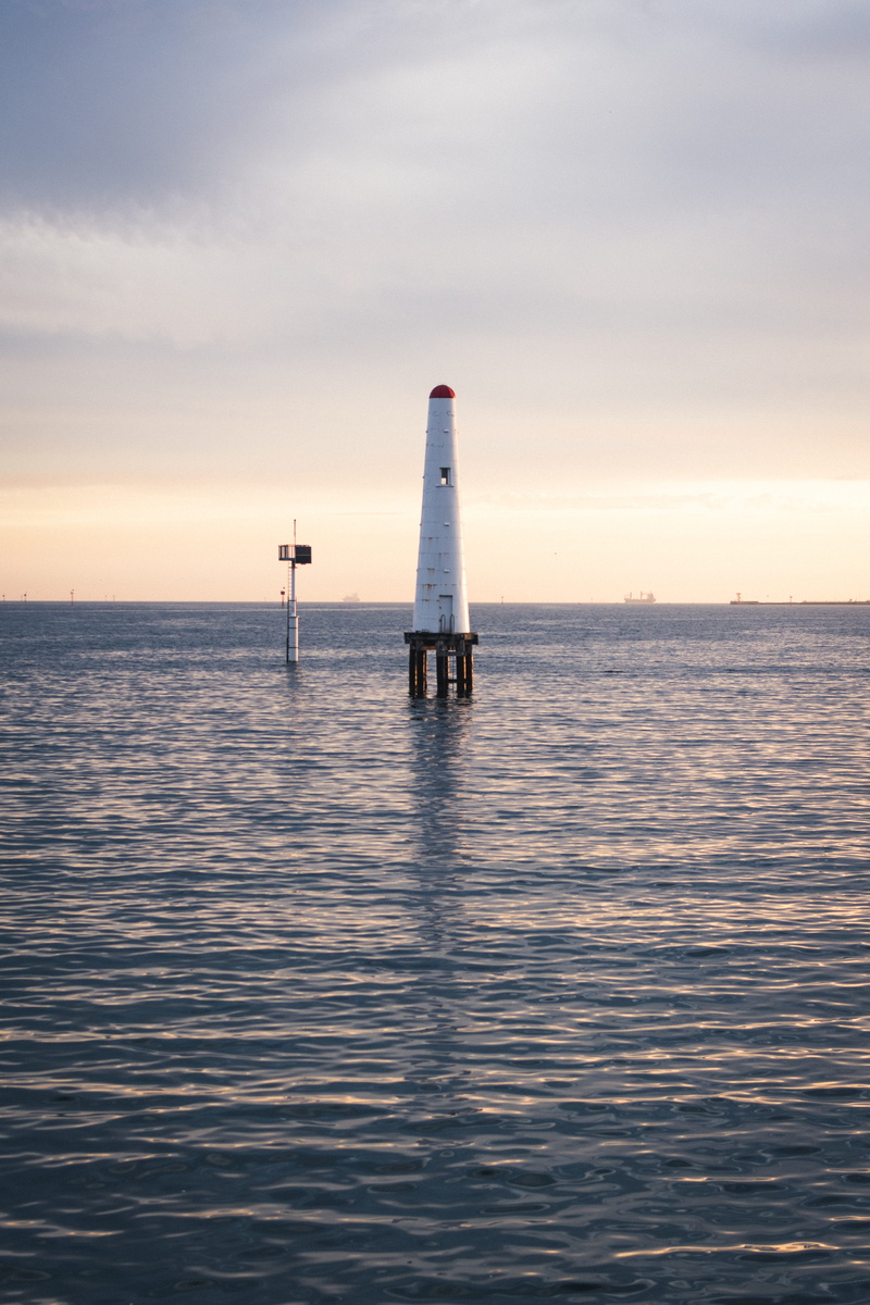 sailboat, horizon over water, built structure, tranquil scene, sunset, sky, sun, scenics - nature, port melbourne, lighthouse, beauty in nature, boat, safety