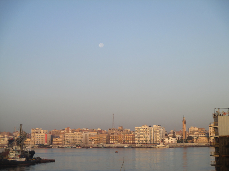 sea, river, ship, port, copy space, sky, daytime, outdoors, building, skyscraper, suez canal, office building exterior, no people, water, city, building exterior