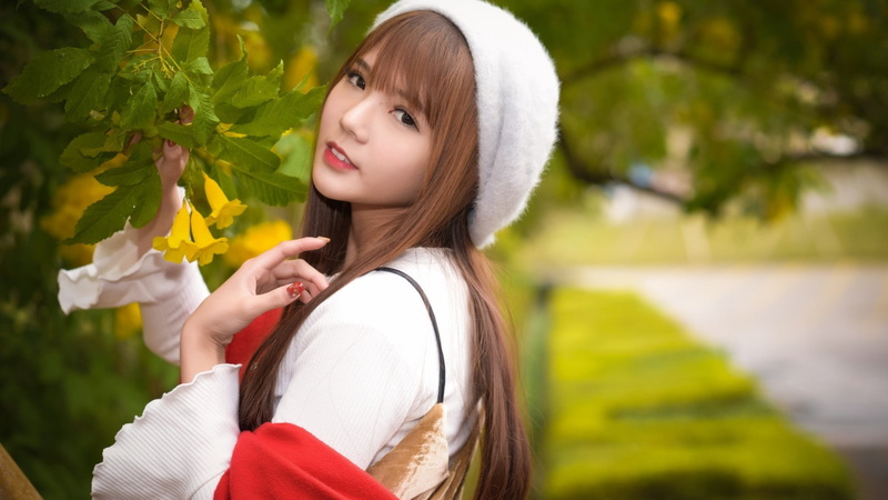 women, trees, looking at viewer, side view, one person, white tops, portrait, outdoors, flowering plant, focus on foreground, beautiful woman, millinery