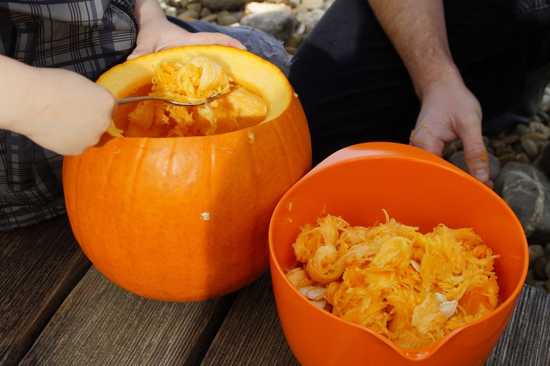 freshness, orange, bowl, orange color, day, scrape off, diy pumpkin ghost, wellbeing, one person, holding, jack olantern, finger, real people, lid, child