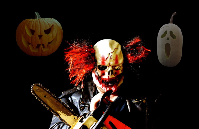 looking at camera, costume, evil, smiling, indoors, celebration, face paint, studio shot, pumpkin face, holding, spooky, halloween, carnival, pumpkin, 31 october