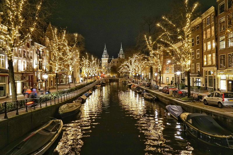 building, light, incidental people, waterfront, illuminated, building exterior, christmas, dutch, nature, city, amsterdam, built structure, tree, neherlands