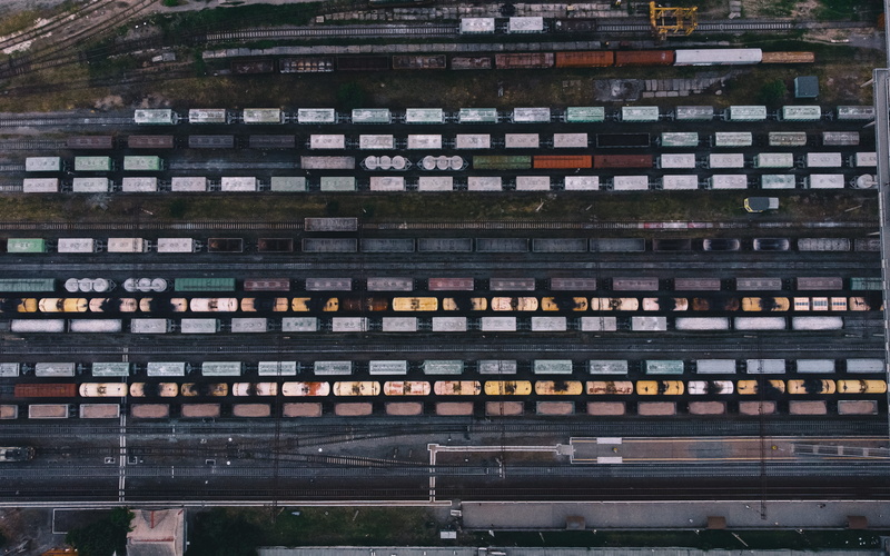 building exterior, outdoors, eye, station, mode of transportation, s, no people, cargo, train carriage, train car, aerial, railway station, high angle view