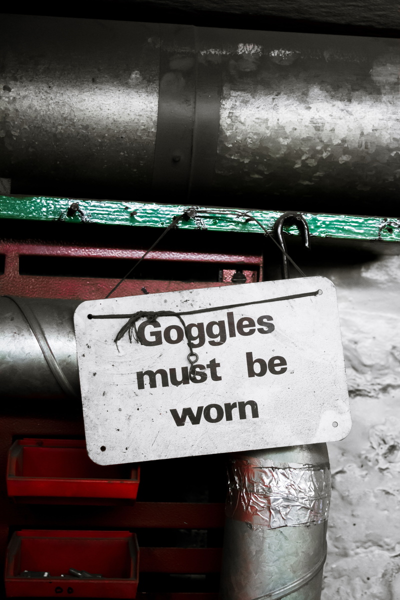 information, metal, googles, outdoor, mode of transportation, western script, machine, communication, outdoors, script, sign, day, silver colored, pipe - tube