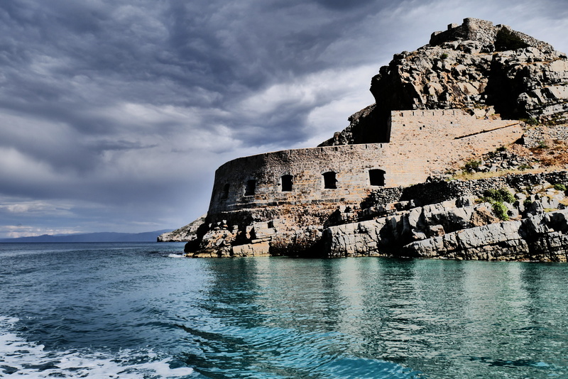 travel, ominous, cloud cover, day, water, rock - object, cloudy, built structure, beach, beauty in nature, weather change, no people, land, ruined, waterfront