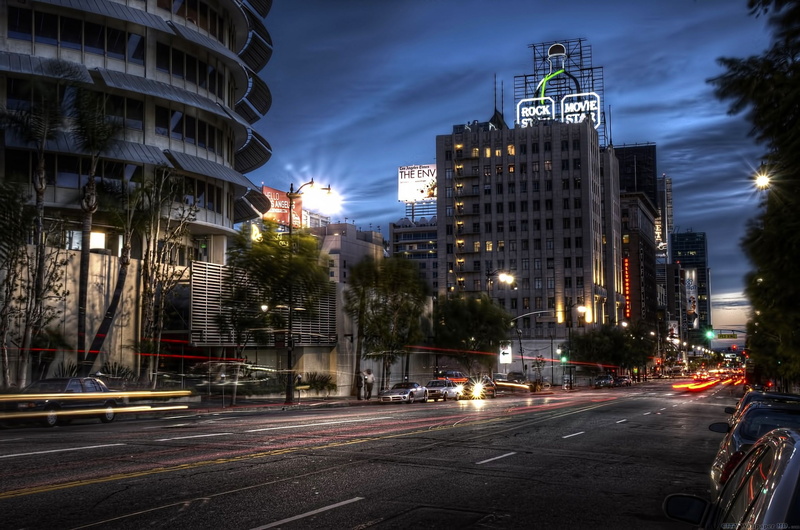 city life, motion, long exposure, no people, built structure, building exterior, mode of transportation, cityscape, skyscraper, light trail, road, sky