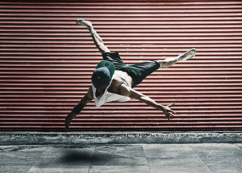 people, jumping, wall - building feature, built structure, skill, metal, dancing, 4K, handstand, mid-air, outdoors, red, air, real people, architecture