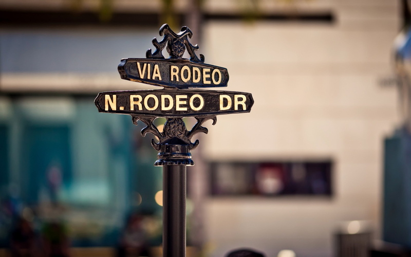 building, sign, building exterior, 2K, nature, metal, road, dr, lighting equipment, n, information, no people, day, outdoors, city, focus on foreground