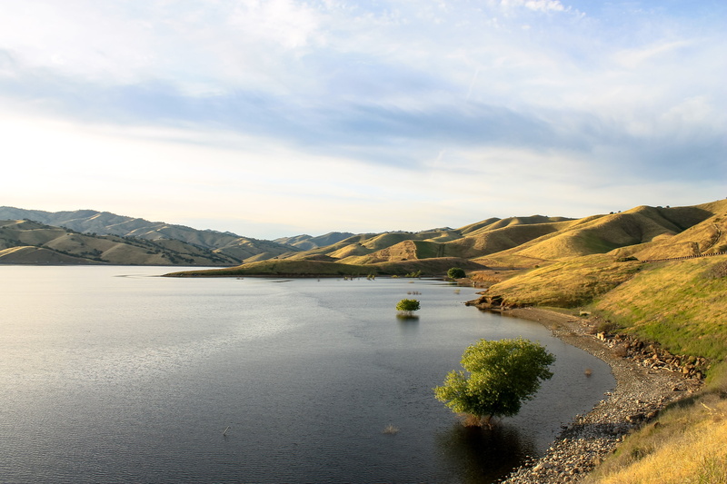 tourism, lake, cloud - sky, tranquil scene, cityscape, landmark, grass, sunny, hills, outdoors, downtown, photography, tree, field, travel, tranquility