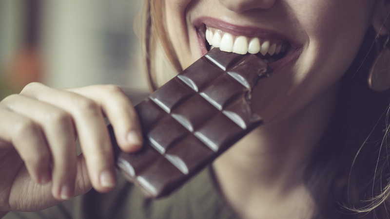 human lips, model, food and drink, face, holding, long hair, human body part, smiling, women, human teeth, body part, depth of field, sweet food, adult