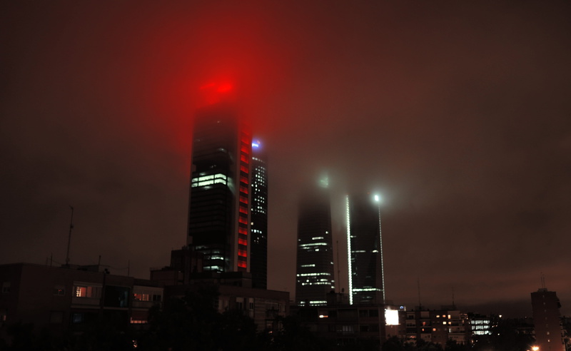 architecture, pollution, outdoors, illuminated, cuatro torres, financial district, built structure, building, night, air pollution, office building exterior