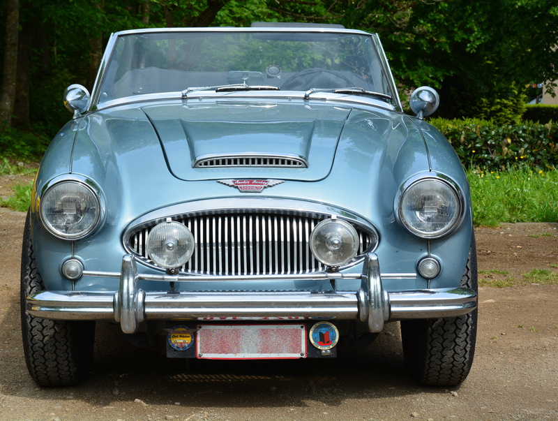 outdoors, text, sunlight, silver colored, austin, land, nature, land vehicle, plant, auto, no people, retro styled, headlight, front view, car, chrome