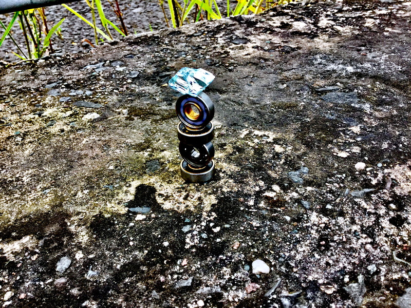 dirt, high angle view, rock, textured, sunlight, bearings, glass, solid, ground, random, security, aerosol can, day, metal, protection, belfast, no people