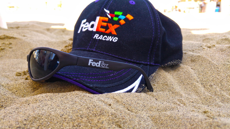 no people, courier, sand, absence, focus on foreground, fashion, nature, hat, personal accessory, 5K, slipper, pebble, sea, safety, text, shoe, sun, black color