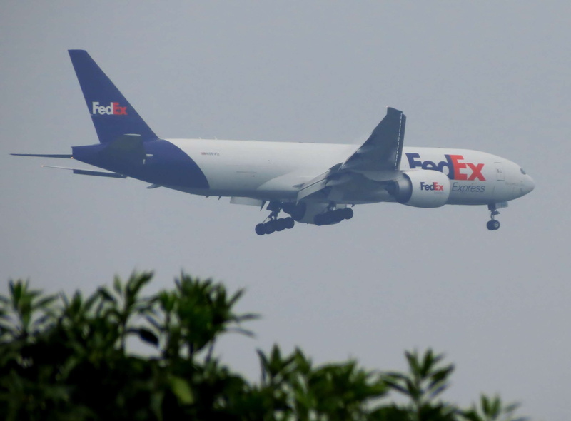 army, transportation, mid-air, nature, fedex, day, no people, military, mode of transportation, fighter plane, plane, aerospace industry, sky, tree, motion