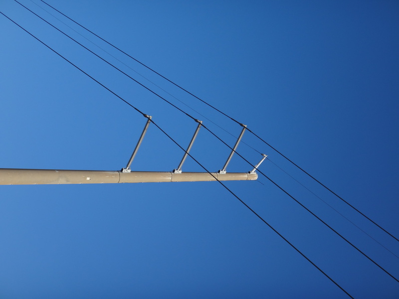 electricity, outdoors, nature, low angle view, sky, no people, power supply, lighting equipment, 4K, copy space, connection, power line, technology, built structure