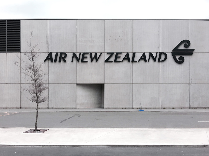 wall - building feature, facade, symbol, space, day, sign, brutalism, road sign, line, clean, street, air, scene, capital letter, textured, building exterior