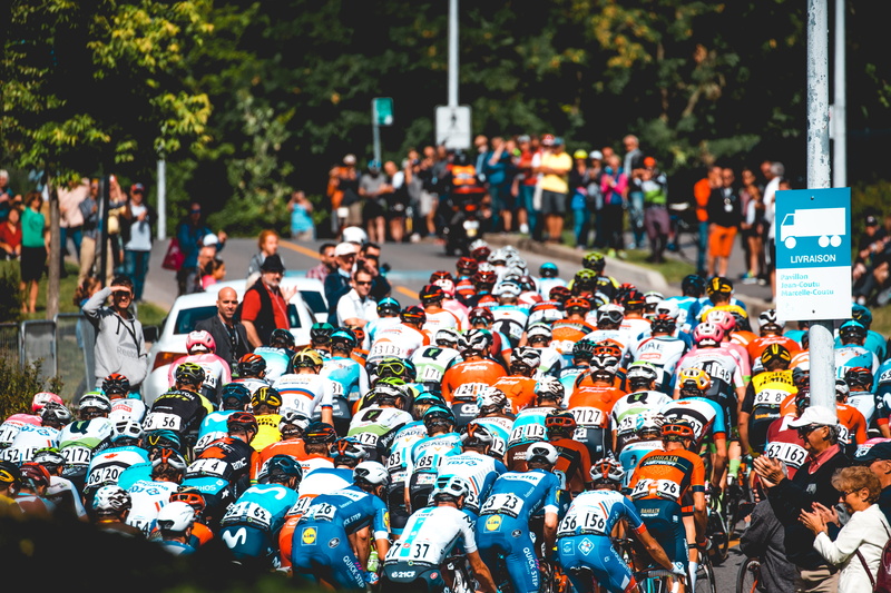 vehicle, motocross, huddle, audience, group, people, land vehicle, montreal, bicycle, outdoors, city, sport, motorcycle, cyclist, city life, men, mode of transportation