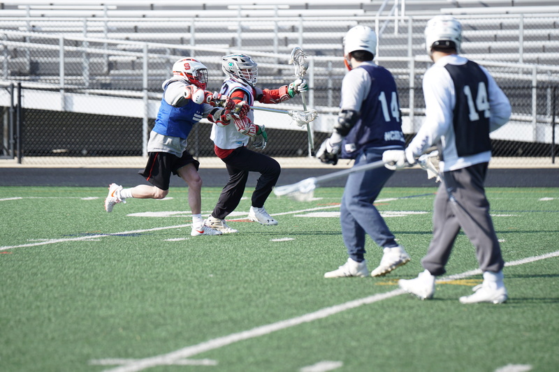 people, field, cooperation, men, day, human, sportsman, motion, apparel, football, four, group of people, team sport, grass, lacrosse, crash helmet, sport