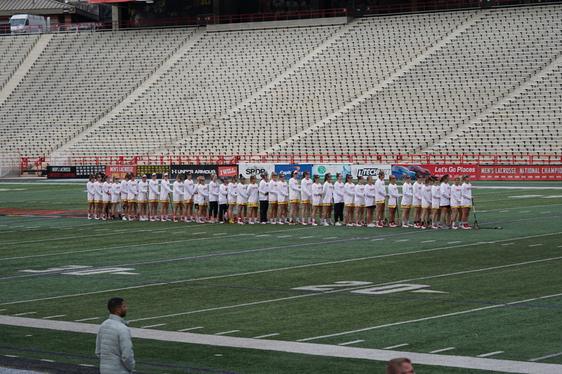 marching, spectator, crowd, human, sport, football field, person, real people, group of people, adult, building, athlete, audience, grass, looking, parade