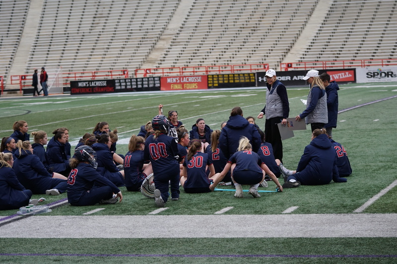 full length, american football, person, sitting, shoe, football helmet, large group of people, adult, human, arena, huddle, architecture, sport, crowd