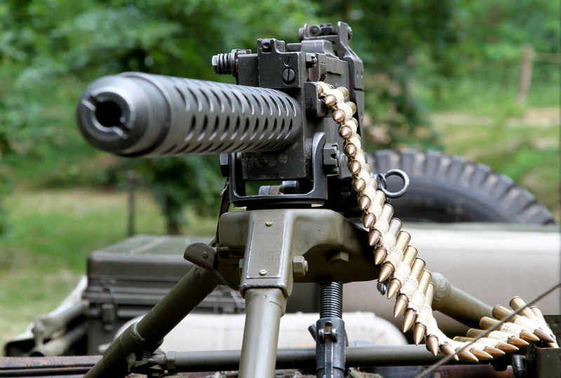 machinery, digital camera, no people, black, still life, tripod, nature, outdoors, technology, weapon, machine gun, selective focus, tape cartridges, 1080P