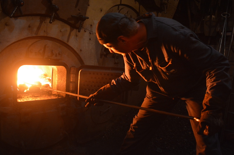 one person, heating, workshop, sparks, three quarter length, 5K, occupation, concentration, effort, real people, heat - temperature, water vapor, steam engine