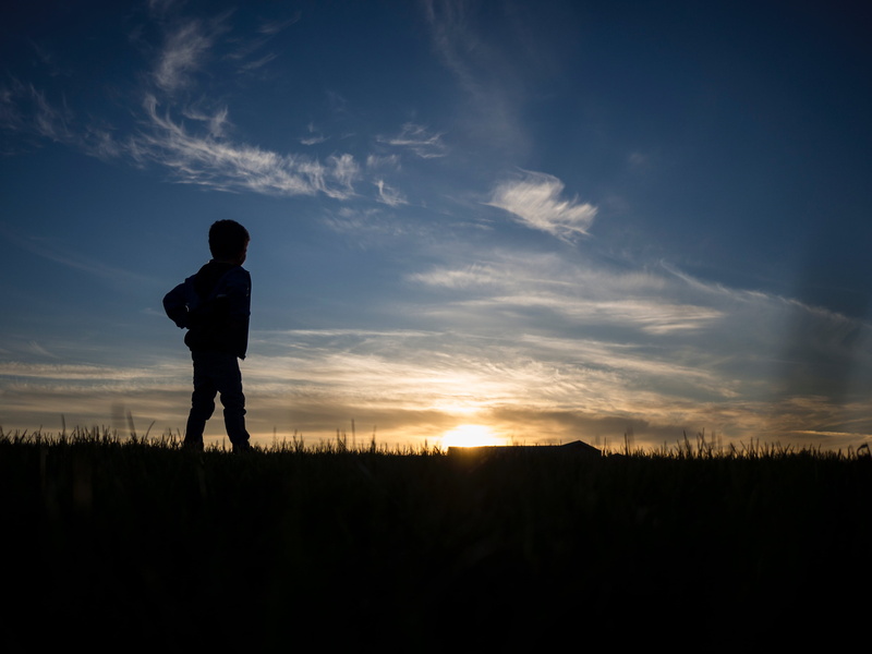tranquil scene, scenics - nature, outdoors, back Lit, boy, tranquility, cloud - sky, leisure activity, men, landscape, one person, lifestyles, real people