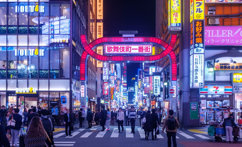 skyscraper, city street, group of people, tarmac, people, person, communication, metropolis, pavement, outdoors, real people, buildings, neon, built structure