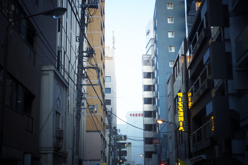 office building, built structure, power supply, residential district, nature, sunlight, communication, near, city, tarmac, sign, day, asphalt, architecture
