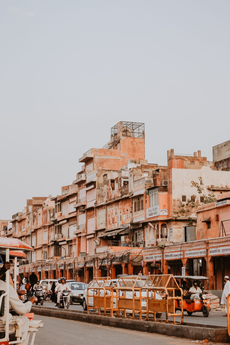 urban, clear sky, wall, building exterior, nature, apartment building, car, outdoors, orange, housing, sky, land vehicle, town, travel, high rise, waterfront