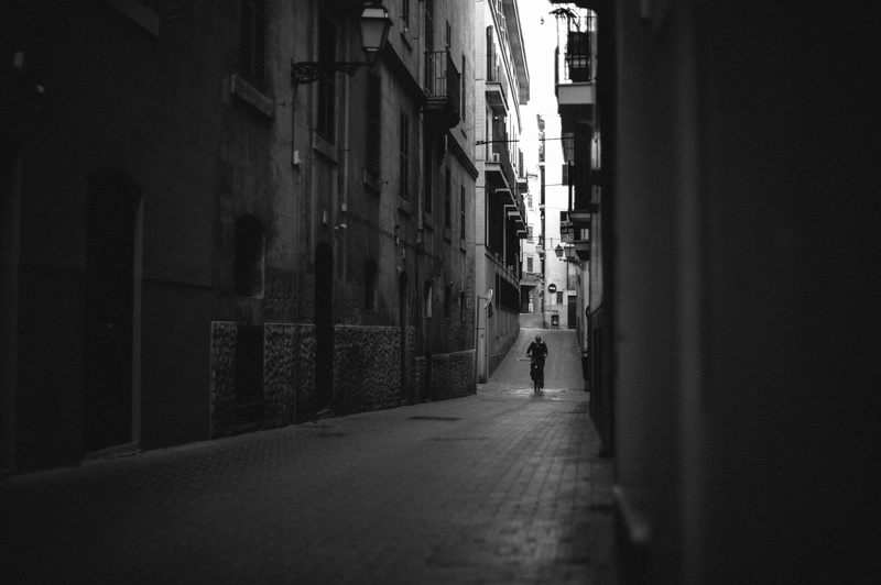 sidewalk, flagstone, road, one person, direction, building exterior, day, outdoors, city, built structure, wall - building feature, urban, pavement, asphalt