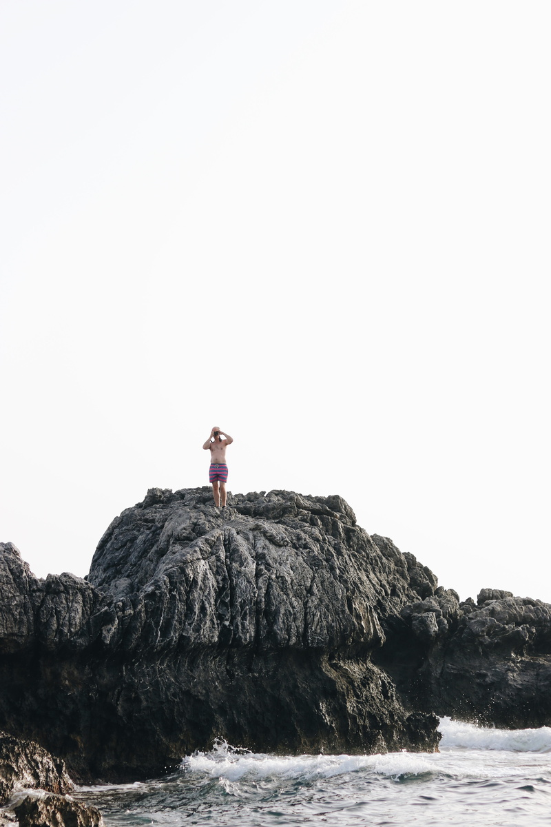 day, beauty in nature, scenics - nature, cove, male, person, sea, copy space, solid, lookout, real people, cliff, sky, leisure activity, lifestyles, man