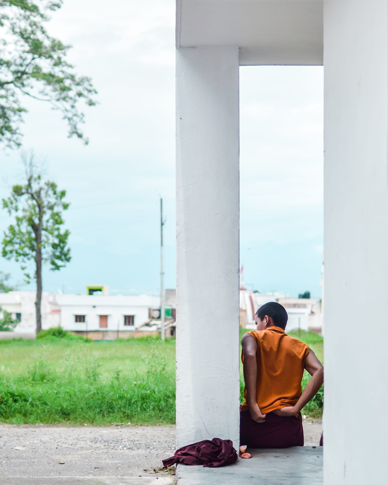 frames, social issues, men, tree, outdoors, day, wall, brown, real people, grass, casual clothing, apparel, pillar, travel, one person, column, leisure activity
