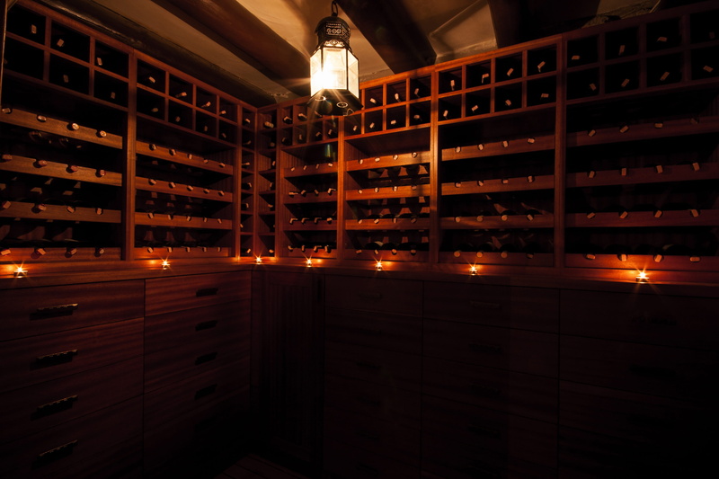 red wine, indoors, cellar, dark, candles, building, warehouse, food and drink, drink, container, refreshment, illuminated, peace, shelf, built structure