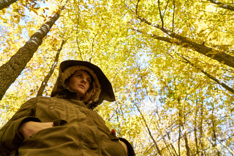 young adult, plant, young model, yellow, nature, young girl, hat, trees, exposure, leaf, womens, change, uniform, tree, one person, headshot, b add, looking away