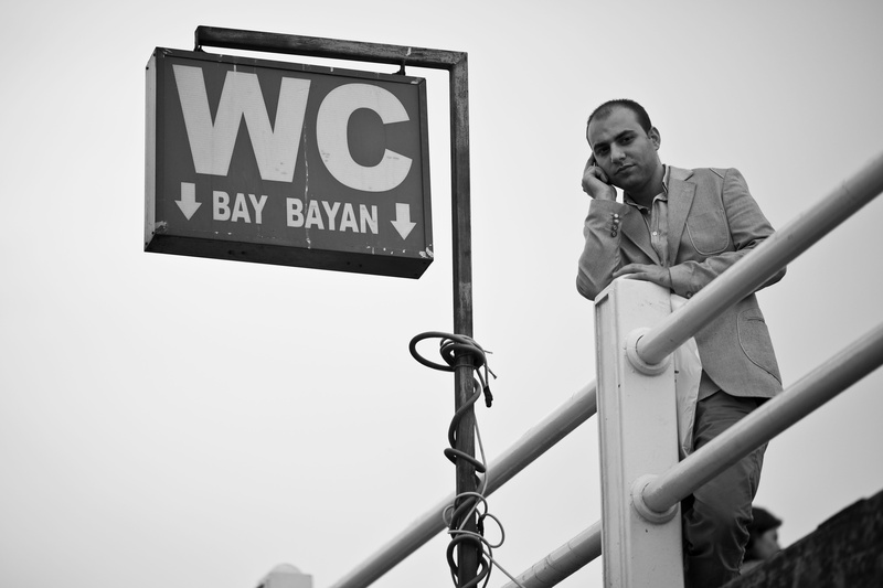 photography, sign, one person, looking away, real people, text, lifestyles, western script, current, talk, young men, b add, communication, contact, standing