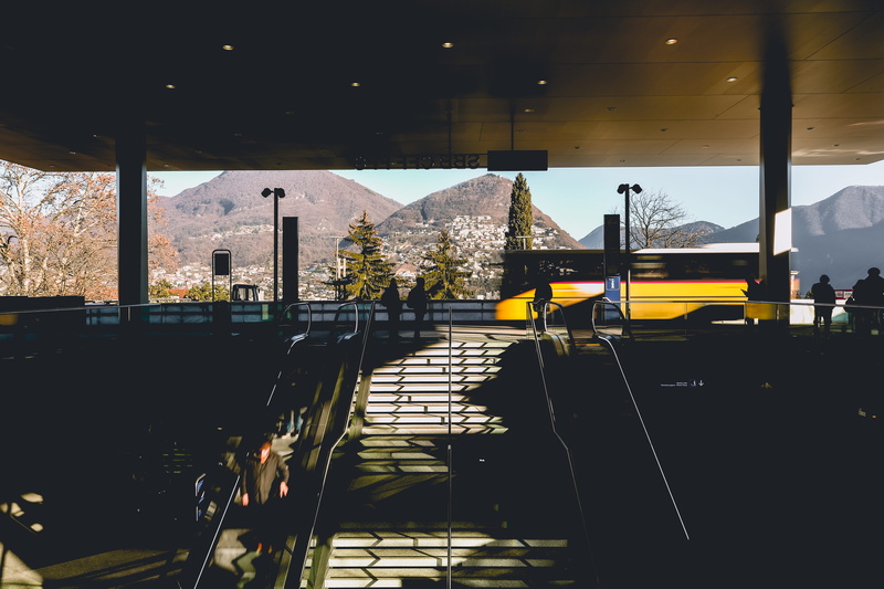 sunlight, nature, trees, chair, built structure, mountain, bus, building exterior, light, 5K, architecture, city, architectural column, sky, outdoors