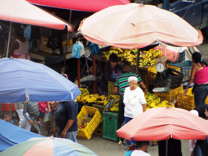 selling, group of people, mercado popular caracas venezuela city challenge, protection, small business, market, for sale, lifestyles, men, outdoors, street market